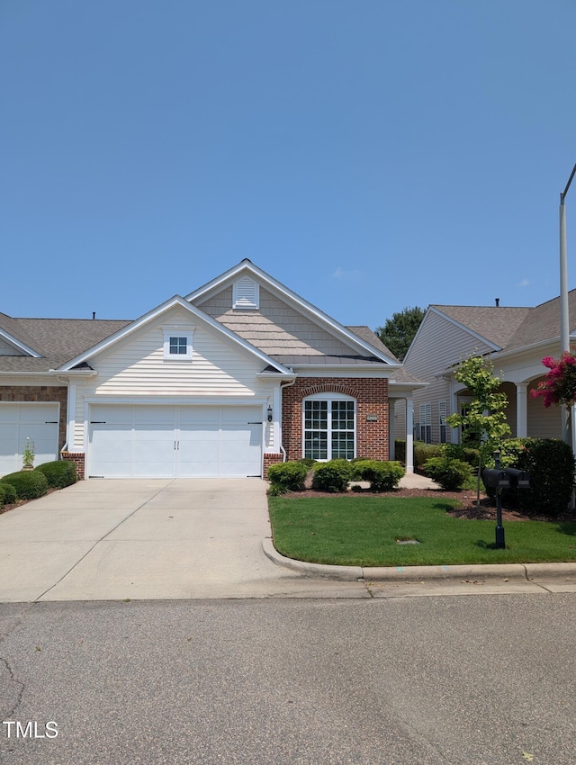 4221 Del Webb Ave, Cary, NC 27519 - view of front of house with brick siding, a garage, concrete driveway, and a front yard