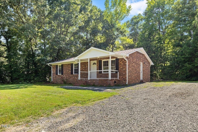 691 Oak Grove Rd, Roxboro, NC 27574 - ranch-style home featuring covered porch, a front yard, and brick siding
