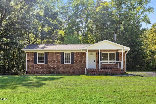 691 Oak Grove Rd, Roxboro, NC 27574 - ranch-style home with a front yard, brick siding, and a porch