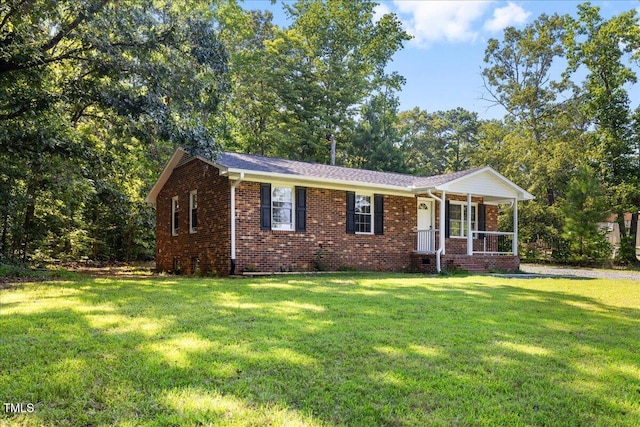 691 Oak Grove Rd, Roxboro, NC 27574 - ranch-style home featuring a front yard, brick siding, and covered porch