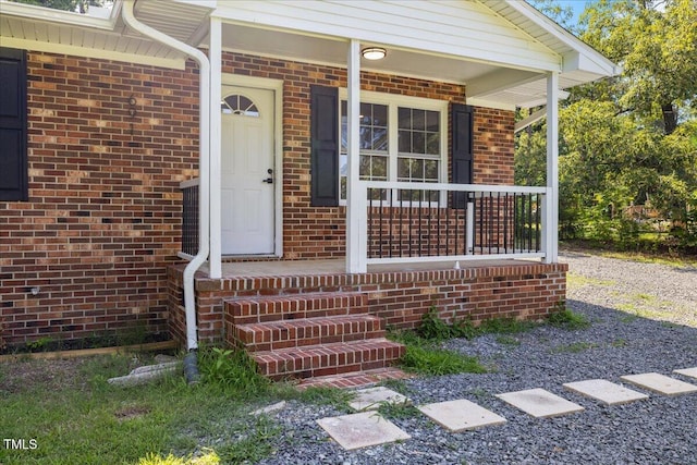 691 Oak Grove Rd, Roxboro, NC 27574 - doorway to property with a porch and brick siding