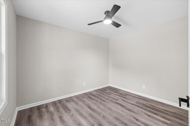 691 Oak Grove Rd, Roxboro, NC 27574 - empty room featuring wood finished floors and ceiling fan