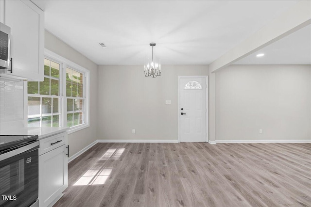 691 Oak Grove Rd, Roxboro, NC 27574 - unfurnished dining area featuring a chandelier, light wood-style floors, and recessed lighting