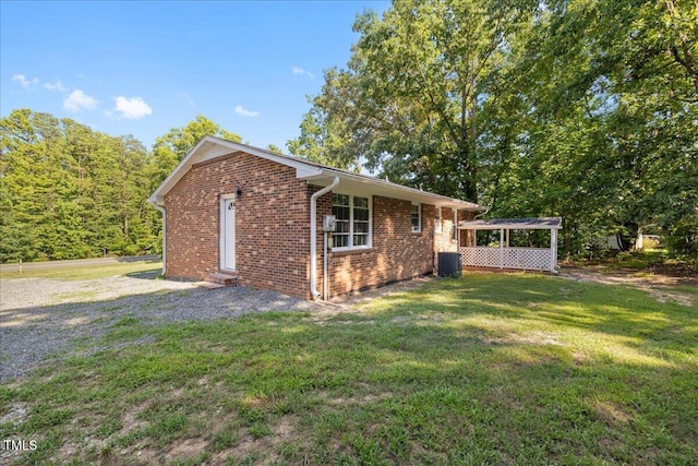 691 Oak Grove Rd, Roxboro, NC 27574 - view of side of property with brick siding, a lawn, and entry steps