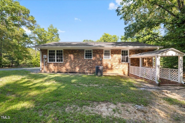 691 Oak Grove Rd, Roxboro, NC 27574 - rear view of property with a lawn and brick siding