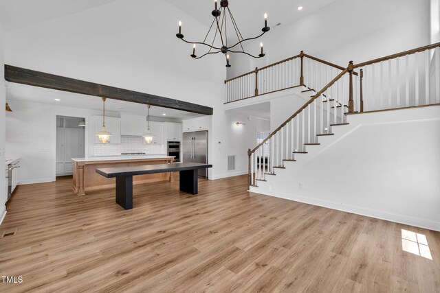 6928 Will Let Ln, Wake Forest, NC 27587 - game room featuring light wood finished floors, a towering ceiling, a chandelier, and recessed lighting