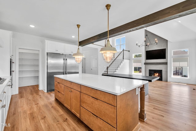 6928 Will Let Ln, Wake Forest, NC 27587 - kitchen featuring stainless steel built in fridge, beam ceiling, a kitchen island, light wood finished floors, and white cabinets