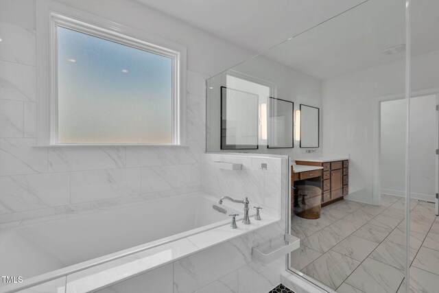 6928 Will Let Ln, Wake Forest, NC 27587 - bathroom with vanity, a garden tub, and marble look tile flooring