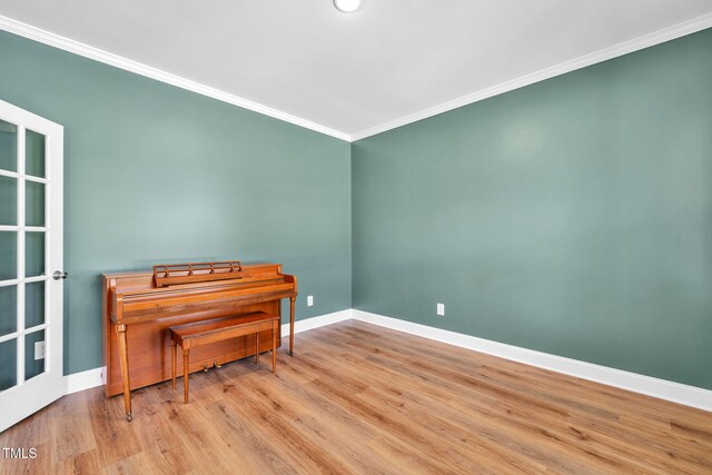 6928 Will Let Ln, Wake Forest, NC 27587 - empty room featuring crown molding and wood finished floors