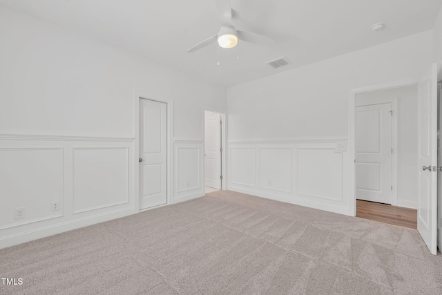 6928 Will Let Ln, Wake Forest, NC 27587 - unfurnished room featuring a decorative wall, a ceiling fan, carpet floors, a smoke detector, and wainscoting
