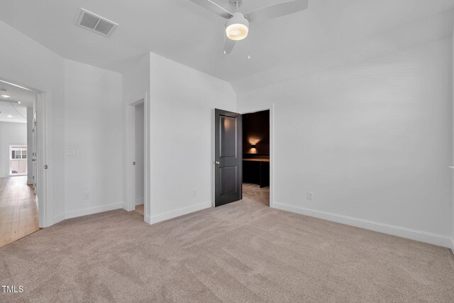6928 Will Let Ln, Wake Forest, NC 27587 - unfurnished bedroom featuring light colored carpet and lofted ceiling