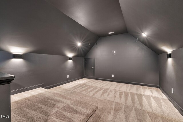 6928 Will Let Ln, Wake Forest, NC 27587 - carpeted cinema featuring vaulted ceiling and baseboards