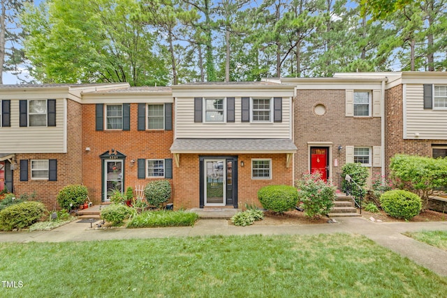 6311 New Market Way, Raleigh, NC 27615 - multi unit property with a front lawn and brick siding