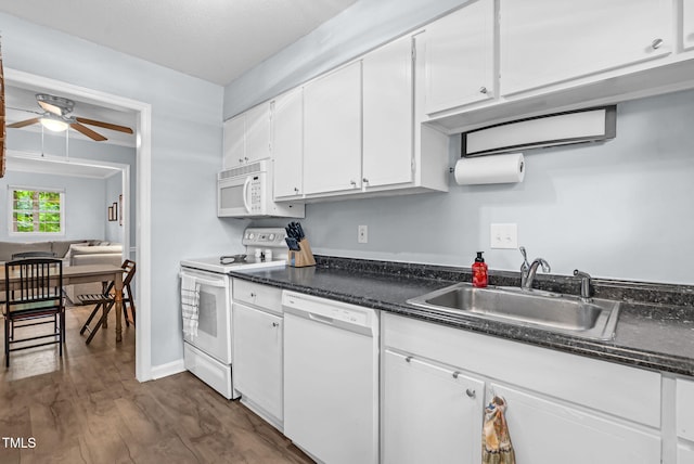 6311 New Market Way, Raleigh, NC 27615 - kitchen with white appliances, ceiling fan, white cabinetry, and dark wood-type flooring