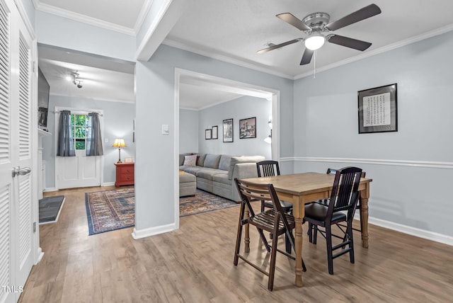 6311 New Market Way, Raleigh, NC 27615 - dining area with ceiling fan, wood finished floors, and crown molding