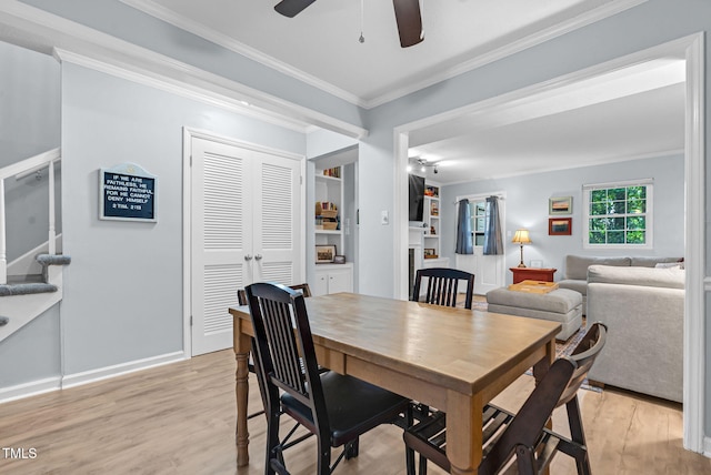 6311 New Market Way, Raleigh, NC 27615 - dining space with light wood-style floors, crown molding, and ceiling fan