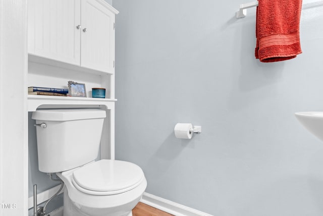 6311 New Market Way, Raleigh, NC 27615 - bathroom with toilet and wood finished floors