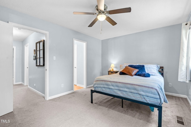 6311 New Market Way, Raleigh, NC 27615 - carpeted bedroom featuring baseboards and ceiling fan