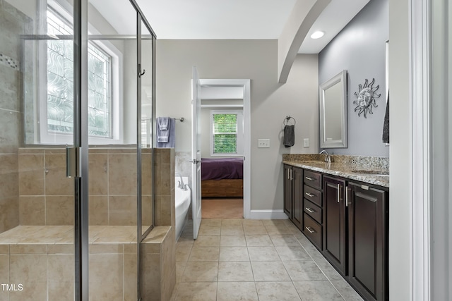 5116 Trembath Ln, Cary, NC 27519 - ensuite bathroom with double vanity, a stall shower, tile patterned floors, a bathtub, and recessed lighting