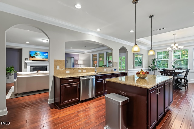 5116 Trembath Ln, Cary, NC 27519 - kitchen with dishwasher, a raised ceiling, crown molding, dark wood-style floors, and light stone counters