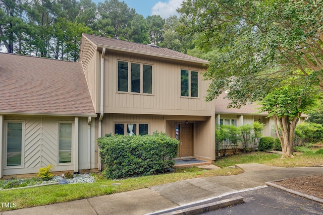 122 Woodbridge Ln, Chapel Hill, NC 27514 - view of front of home with a shingled roof and uncovered parking