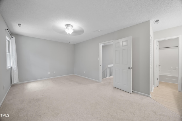 122 Woodbridge Ln, Chapel Hill, NC 27514 - unfurnished bedroom with light carpet and a textured ceiling