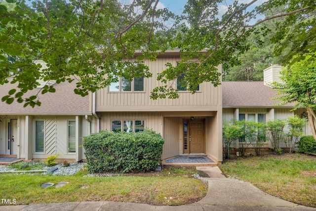 122 Woodbridge Ln, Chapel Hill, NC 27514 - multi unit property with roof with shingles and a chimney