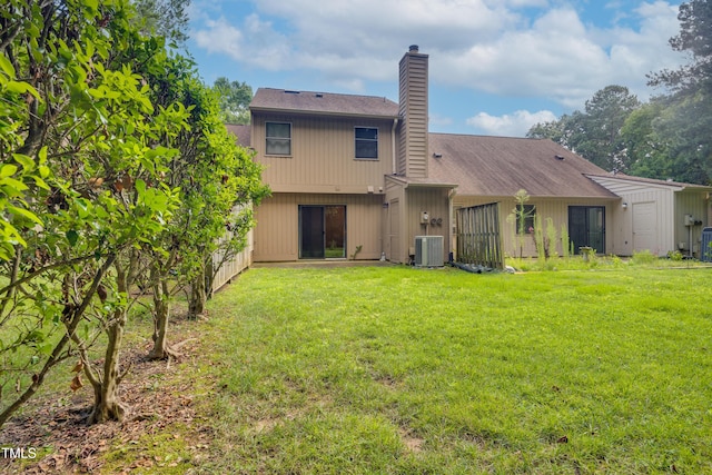 122 Woodbridge Ln, Chapel Hill, NC 27514 - back of property with a chimney, a yard, and roof with shingles