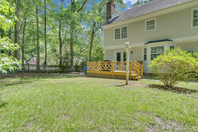 1200 Cambridge Rd NW, Wilson, NC 27896 - rear view of house featuring a wooden deck, a chimney, and french doors
