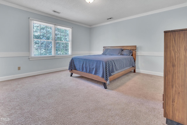 1200 Cambridge Rd NW, Wilson, NC 27896 - bedroom with ornamental molding, a textured ceiling, and carpet flooring