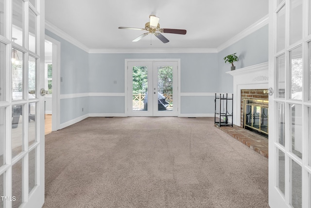 1200 Cambridge Rd NW, Wilson, NC 27896 - unfurnished living room featuring french doors, carpet flooring, crown molding, a fireplace, and ceiling fan