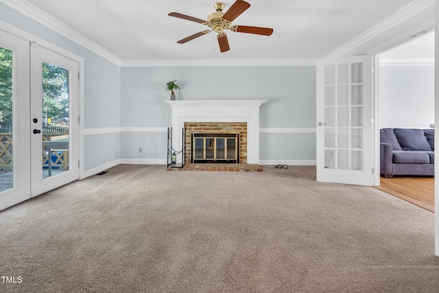 1200 Cambridge Rd NW, Wilson, NC 27896 - unfurnished living room featuring french doors, crown molding, carpet flooring, a fireplace, and ceiling fan