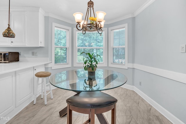 1200 Cambridge Rd NW, Wilson, NC 27896 - dining space with plenty of natural light, a chandelier, crown molding, and light marble finish floors