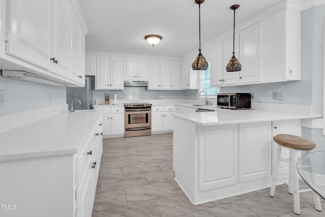 1200 Cambridge Rd NW, Wilson, NC 27896 - kitchen with stainless steel electric range, light marble finish floors, under cabinet range hood, and a peninsula