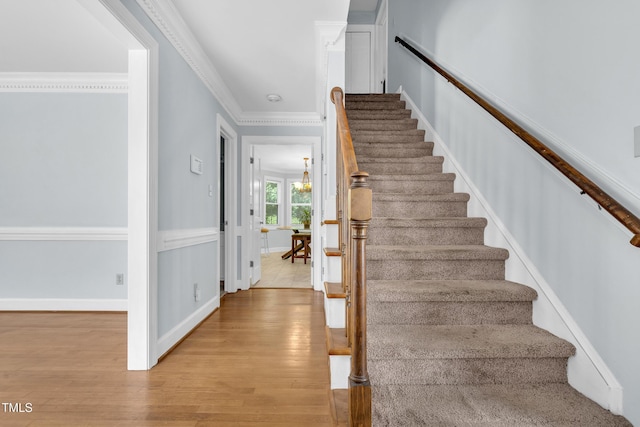 1200 Cambridge Rd NW, Wilson, NC 27896 - staircase featuring wood finished floors and crown molding