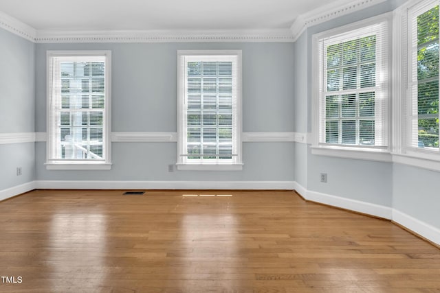1200 Cambridge Rd NW, Wilson, NC 27896 - spare room featuring hardwood / wood-style floors and ornamental molding