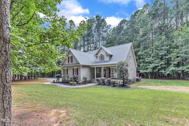 2103 Troys Trl, Franklinton, NC 27525 - view of front facade featuring a front yard, a shingled roof, and covered porch