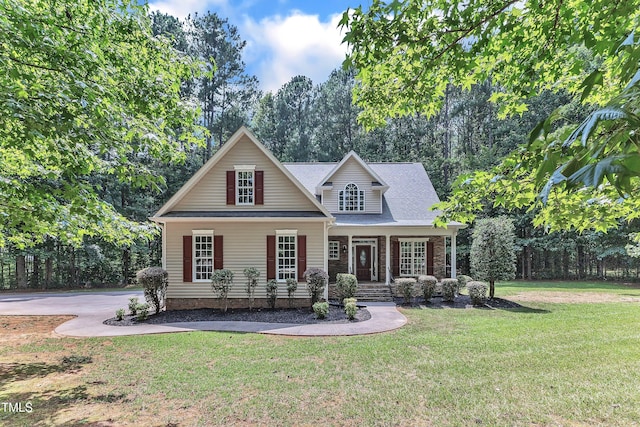 2103 Troys Trl, Franklinton, NC 27525 - view of front of property featuring a front yard, covered porch, and a shingled roof