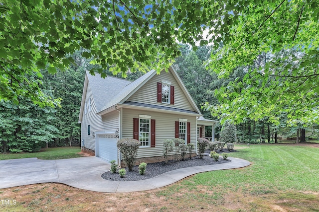 2103 Troys Trl, Franklinton, NC 27525 - traditional home featuring concrete driveway, a front yard, an attached garage, and a shingled roof
