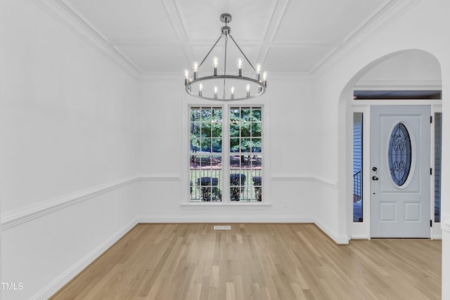 2103 Troys Trl, Franklinton, NC 27525 - unfurnished dining area with wood finished floors, a chandelier, arched walkways, and coffered ceiling