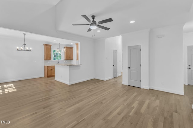 2103 Troys Trl, Franklinton, NC 27525 - unfurnished living room featuring a ceiling fan, light wood-style flooring, a chandelier, recessed lighting, and ornamental molding