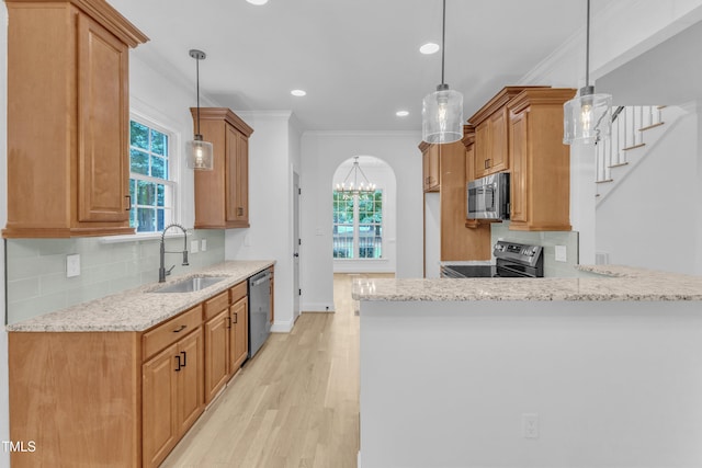 2103 Troys Trl, Franklinton, NC 27525 - kitchen featuring appliances with stainless steel finishes, ornamental molding, light stone counters, recessed lighting, and light wood-type flooring