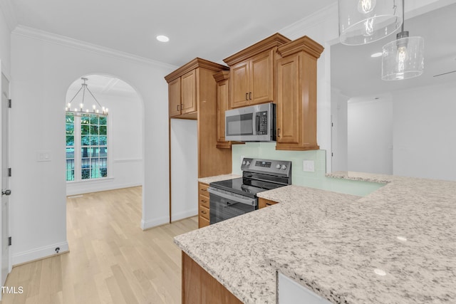 2103 Troys Trl, Franklinton, NC 27525 - kitchen with appliances with stainless steel finishes, light wood-style flooring, crown molding, arched walkways, and light stone countertops