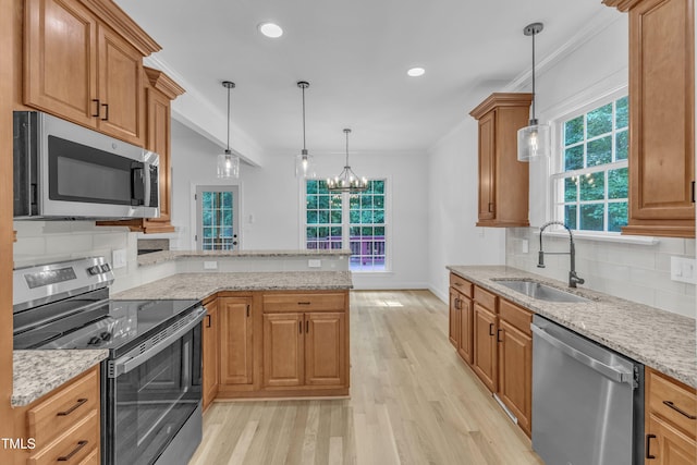 2103 Troys Trl, Franklinton, NC 27525 - kitchen featuring stainless steel appliances, light wood-style flooring, backsplash, a peninsula, and recessed lighting