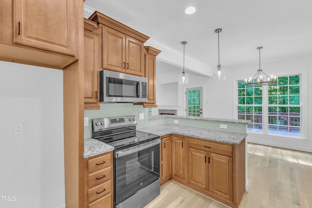 2103 Troys Trl, Franklinton, NC 27525 - kitchen featuring stainless steel appliances, a peninsula, light wood-type flooring, light stone countertops, and plenty of natural light