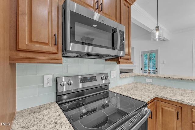 2103 Troys Trl, Franklinton, NC 27525 - kitchen featuring appliances with stainless steel finishes, backsplash, crown molding, pendant lighting, and light stone counters