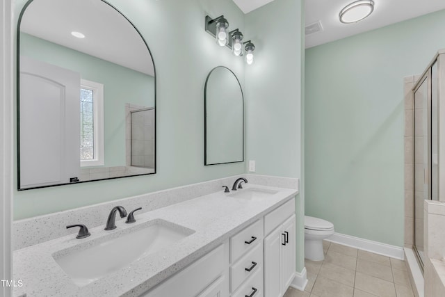 2103 Troys Trl, Franklinton, NC 27525 - full bathroom featuring tiled shower, double vanity, and tile patterned flooring