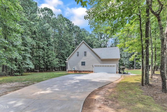 2103 Troys Trl, Franklinton, NC 27525 - view of property exterior featuring crawl space, driveway, a lawn, and roof with shingles
