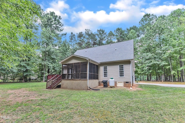 2103 Troys Trl, Franklinton, NC 27525 - rear view of house with a sunroom, roof with shingles, a lawn, stairs, and view of scattered trees