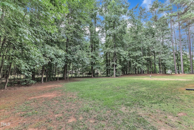 2103 Troys Trl, Franklinton, NC 27525 - view of grassy yard with a wooded view